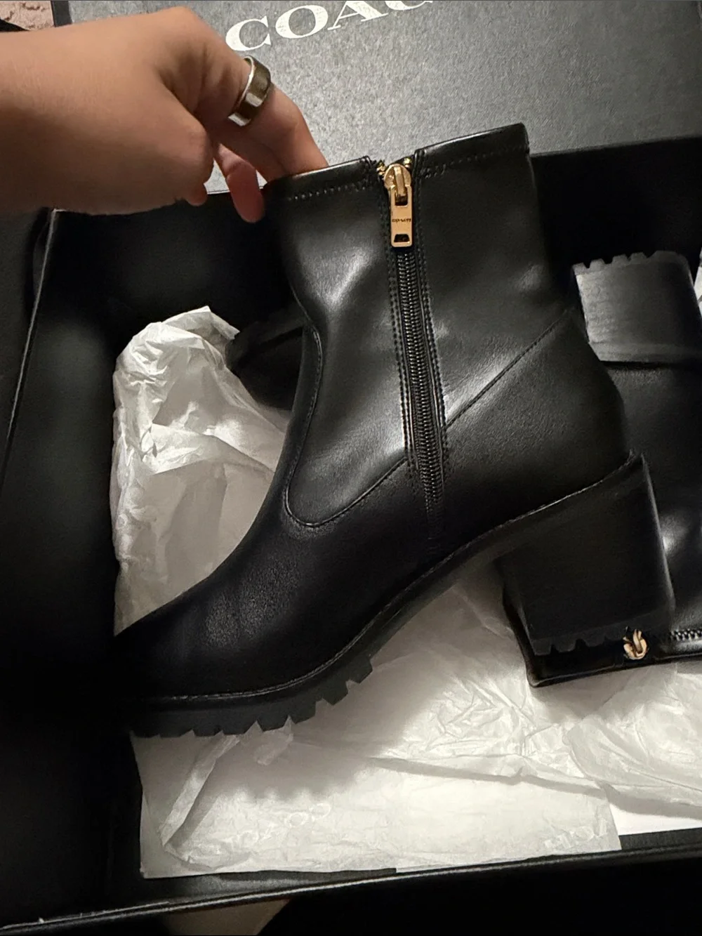 Coach Black Leather Lug Sole Ankle Boots with Gold Zip Accent